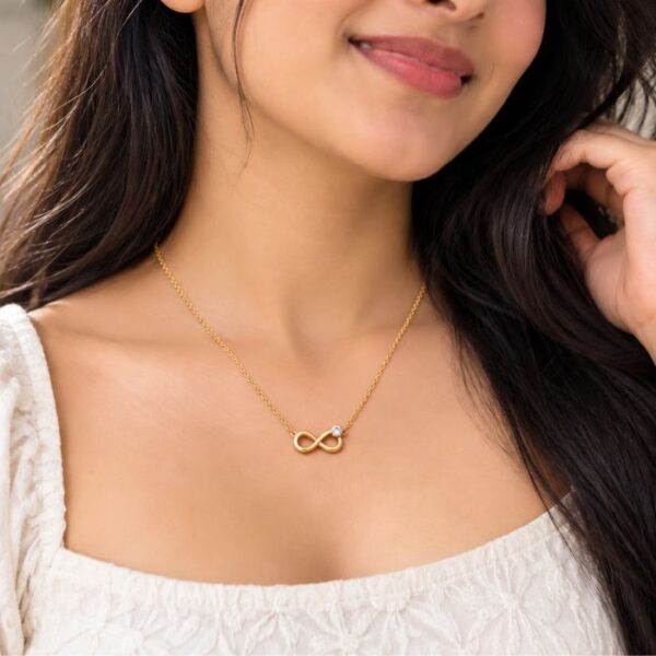 Gold Infinity Pendant Necklace with Crystal Accent